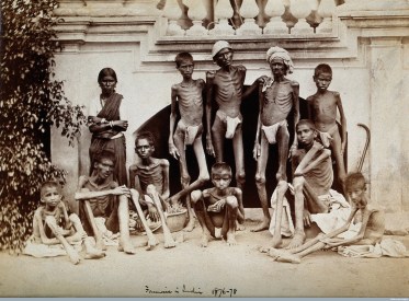 V0029717 Famine in India: a group of emaciated young men wearing loin